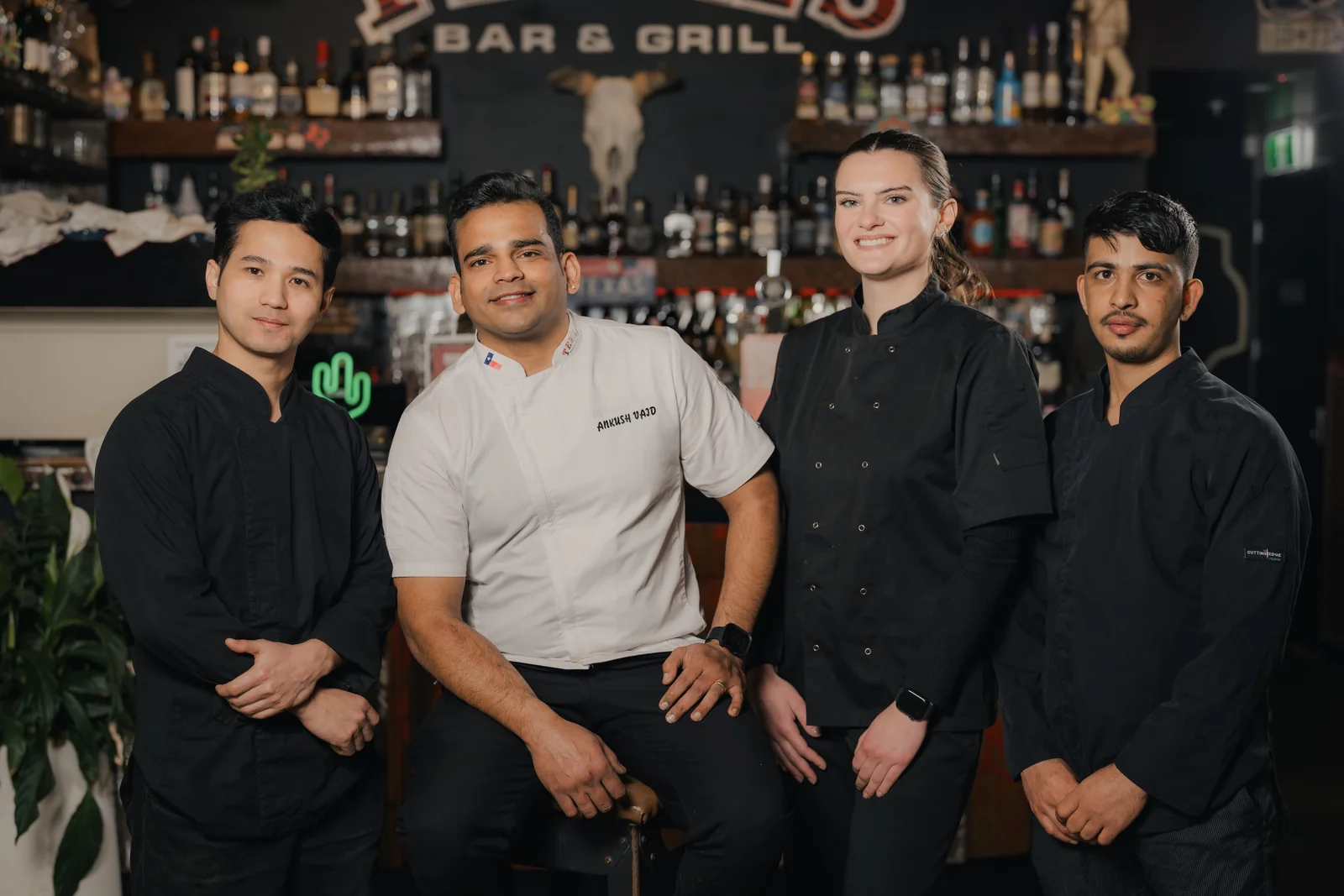 Restaurant staff preparing flame-grilled food